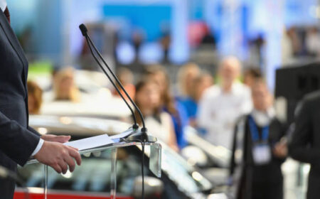 Politician speaking publicly from the lectern during political rally, Nikon Z7
