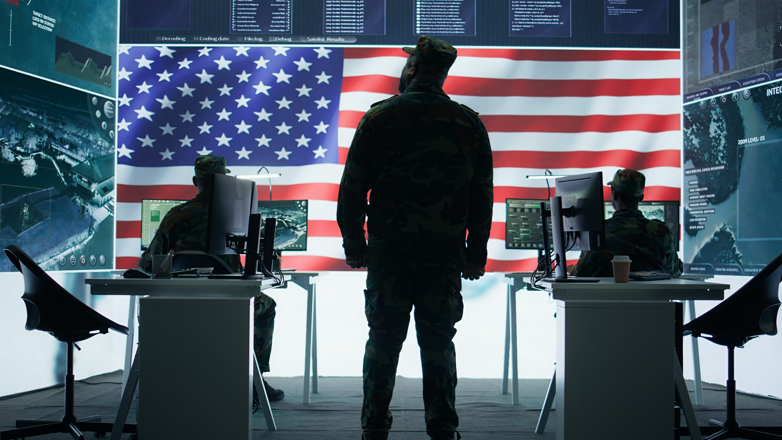 US military officer supervising threat detection activity in high tech office US military officer supervising threat detection activity in high tech office