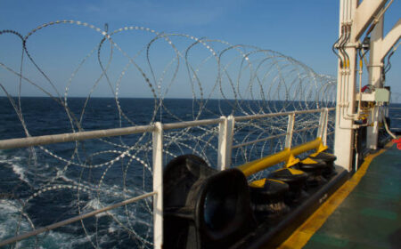 View of the vessel hardening on board a merchant ship using razor wire and wire fencing, to stop pirates from boarding the ship. These ship protection measures are employed when the ship passes through high risk areas.